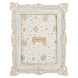 Kék képkeret barokk stílusú fehér díszítéssel