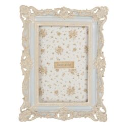Kék képkeret barokk stílusú fehér díszítéssel