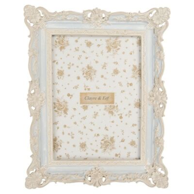 Kék képkeret barokk stílusú fehér díszítéssel