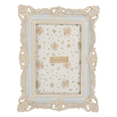 Kék képkeret barokk stílusú fehér díszítéssel